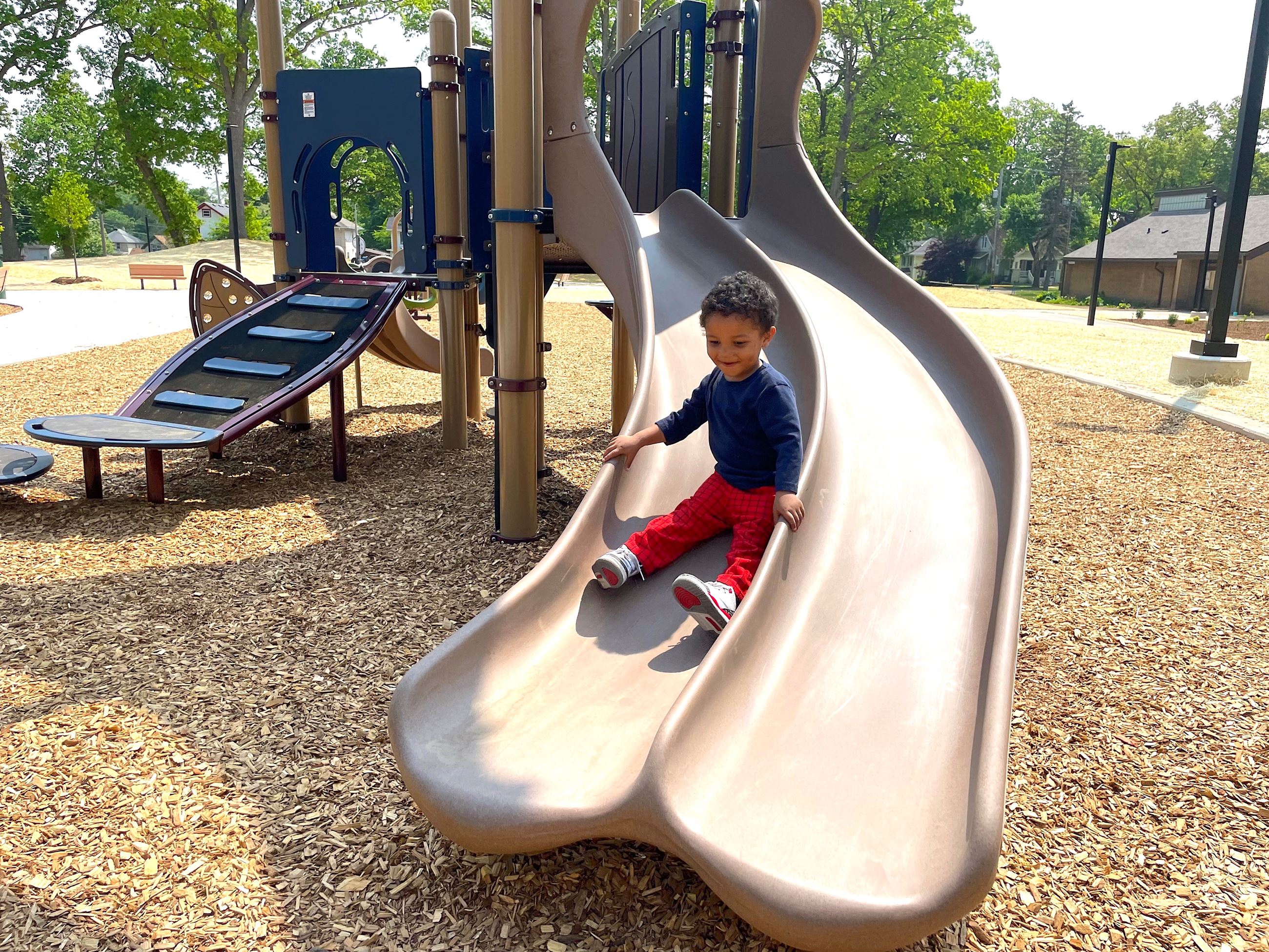 Omari Coleman enjoys the new playground at Loomis Park