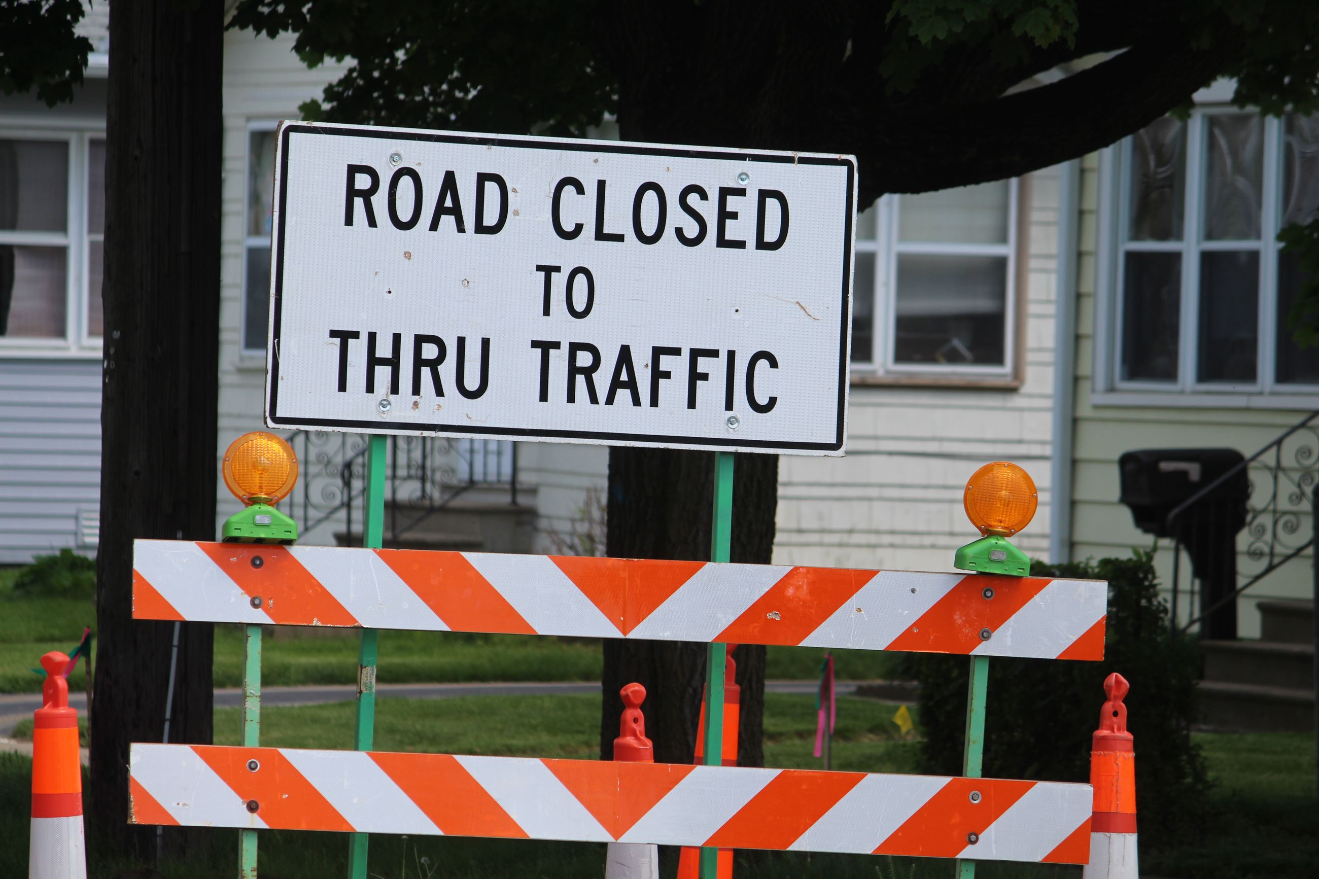 sign that says road closed to through traffic