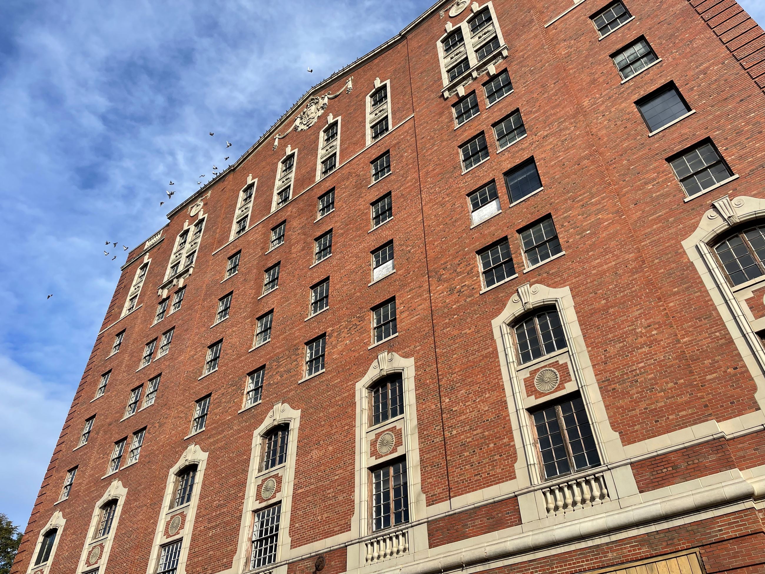 An old and historic tall red brick building 