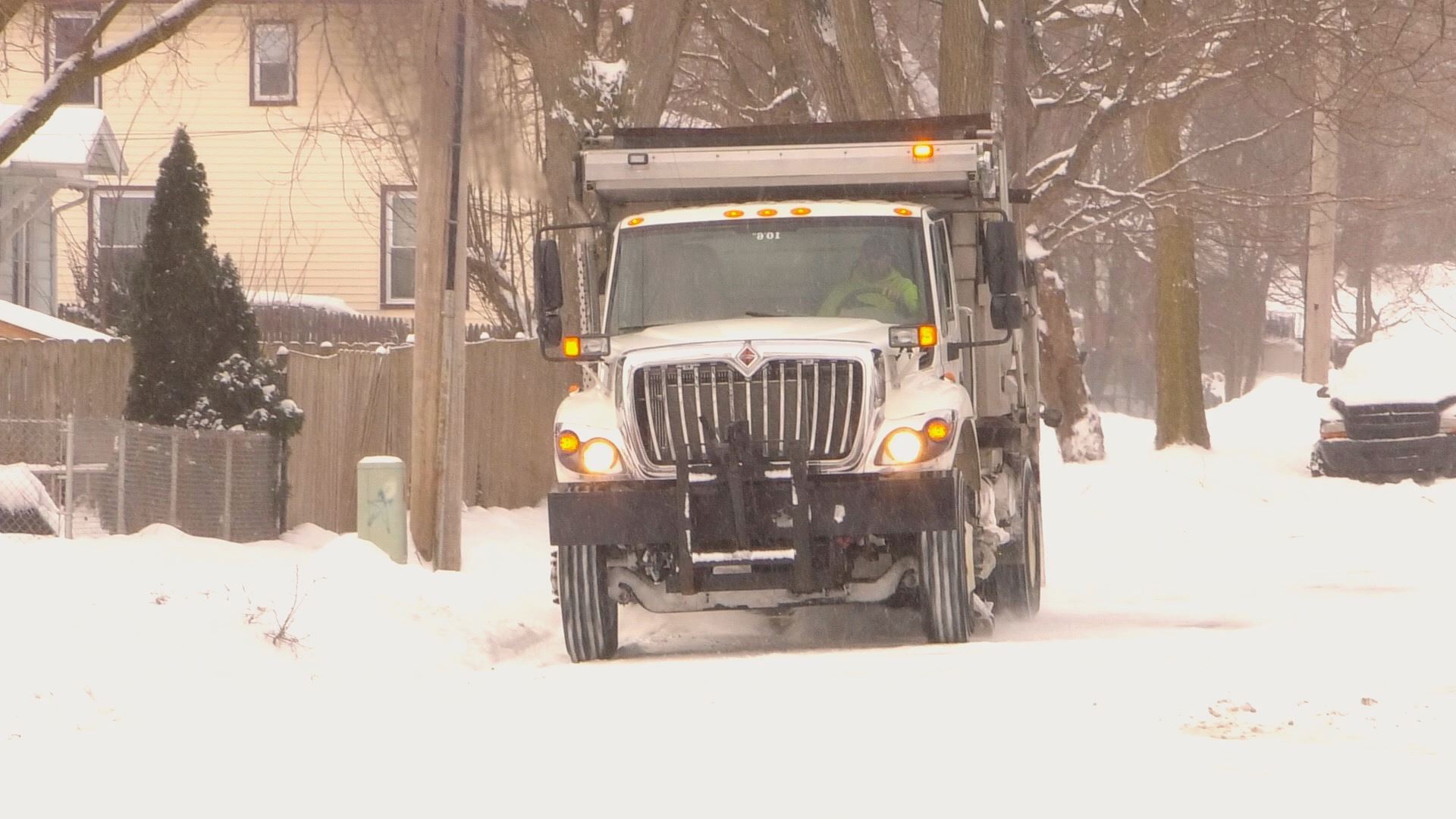 City salt truck on a snowy road in Jackson 