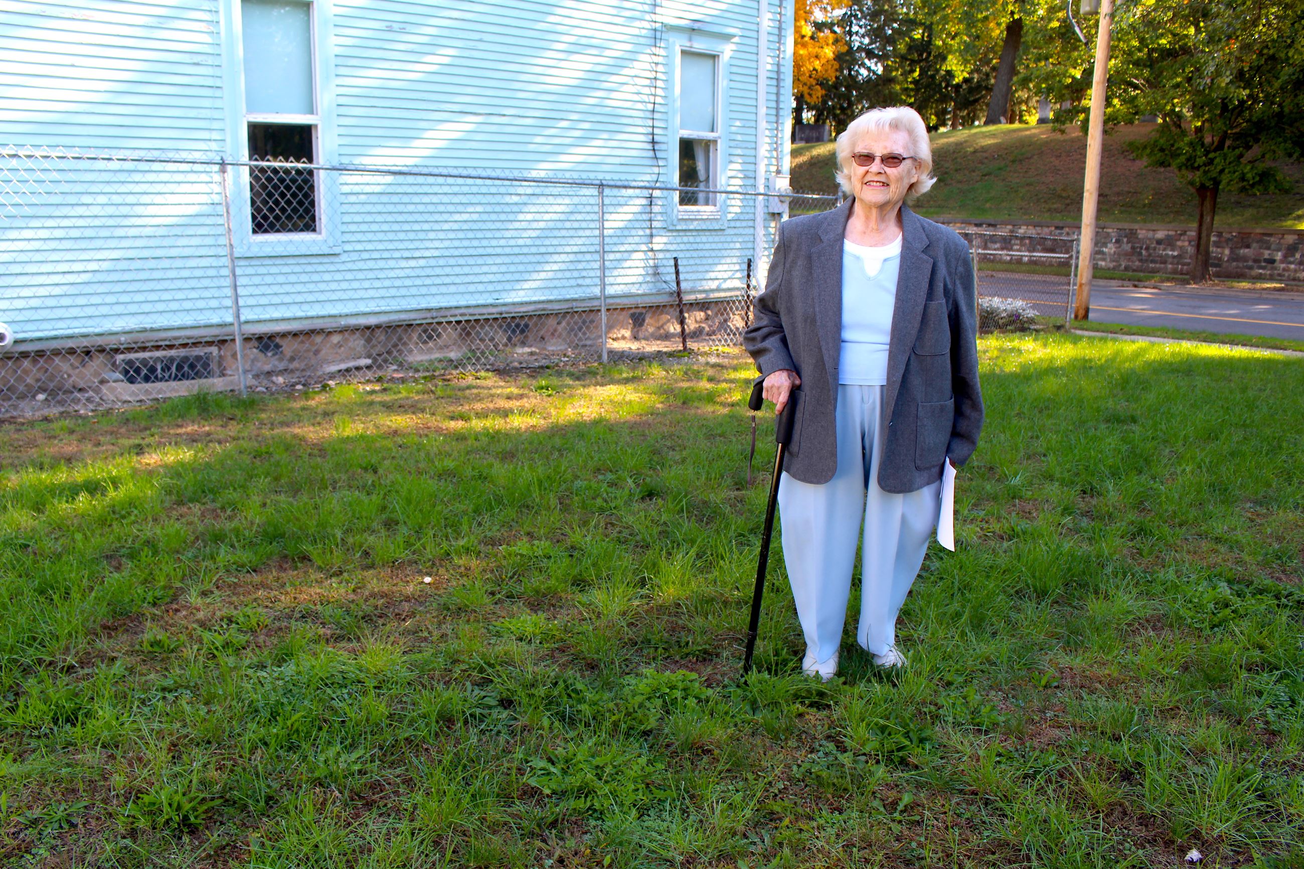 Janet Boyd standing on her newly acquired lot 