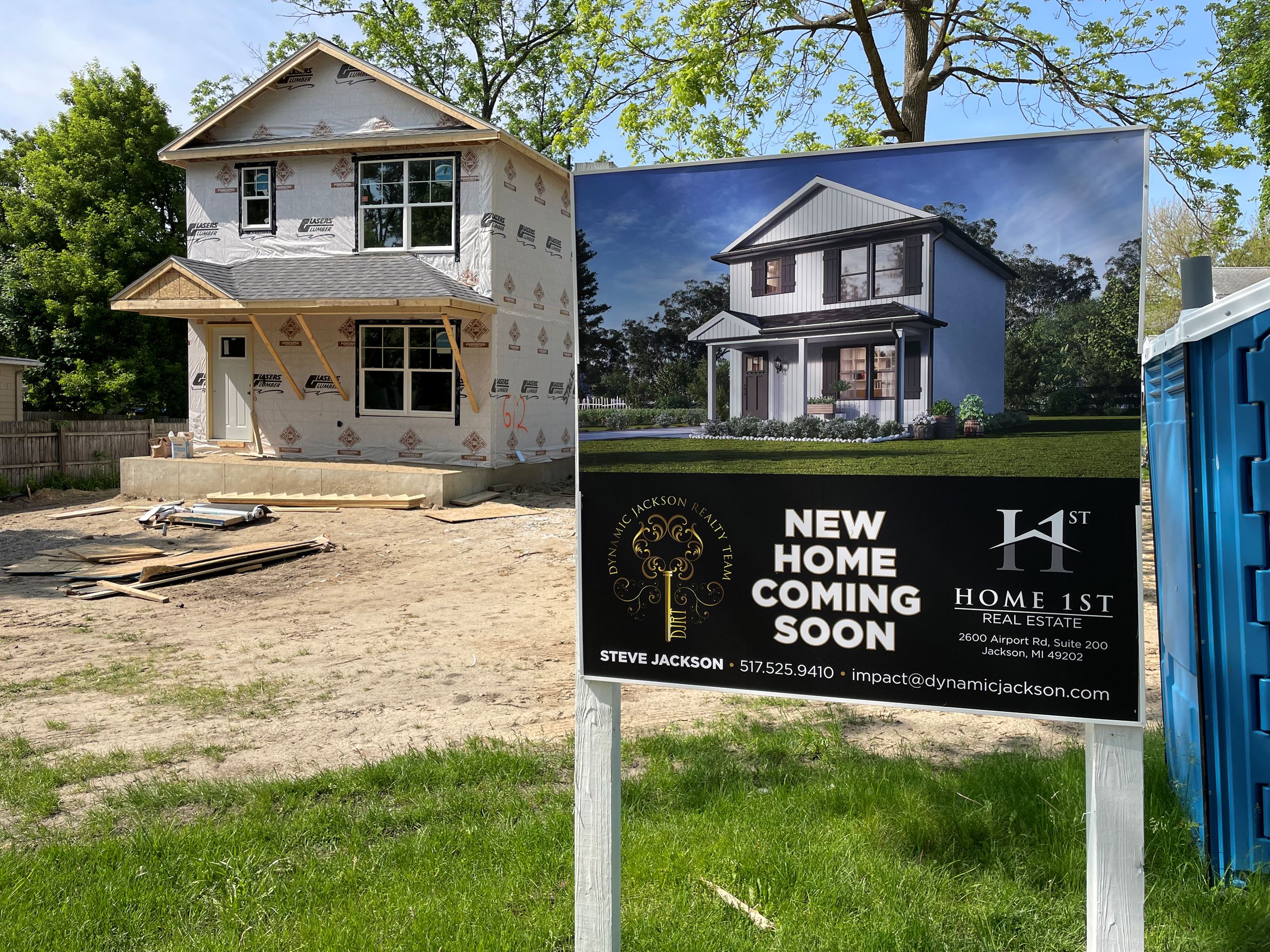 New home under construction with real estate sign on Ganson Street 